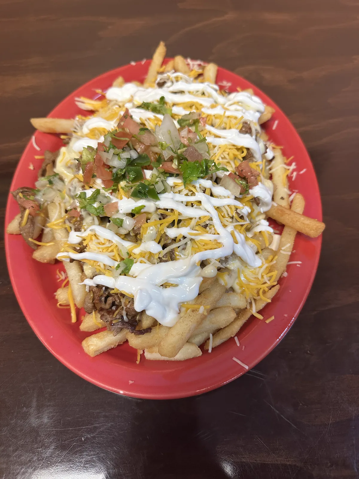 Before: smothered burrito on blue plate with harsh prep-surface reflections